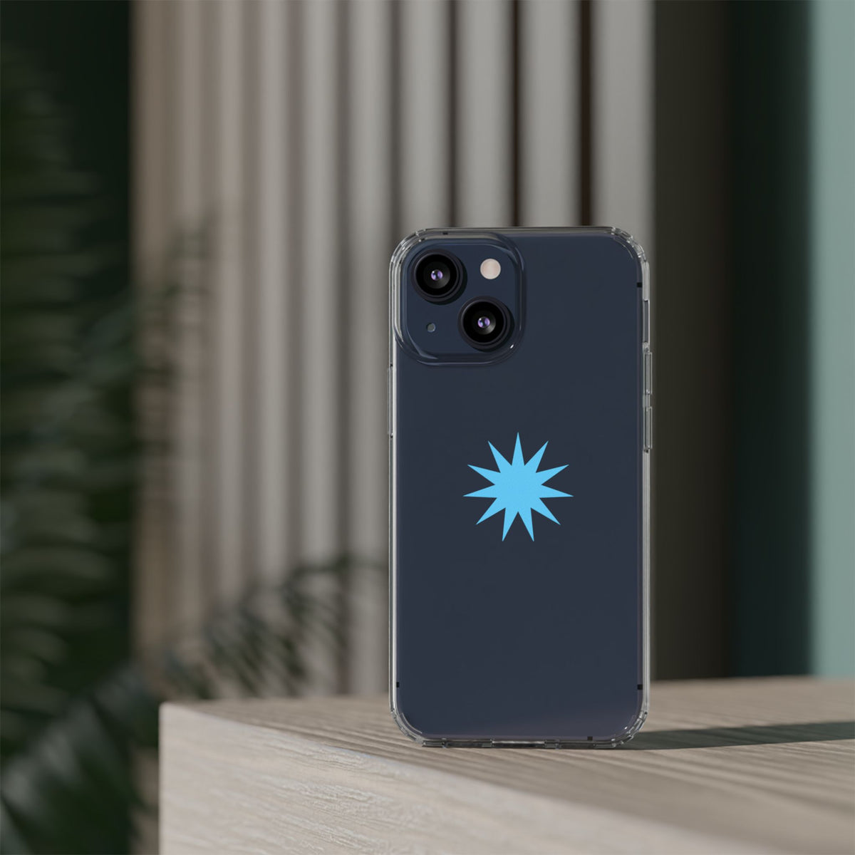 Clear Impact-Resistant Phone Case — Blue Starburst Design