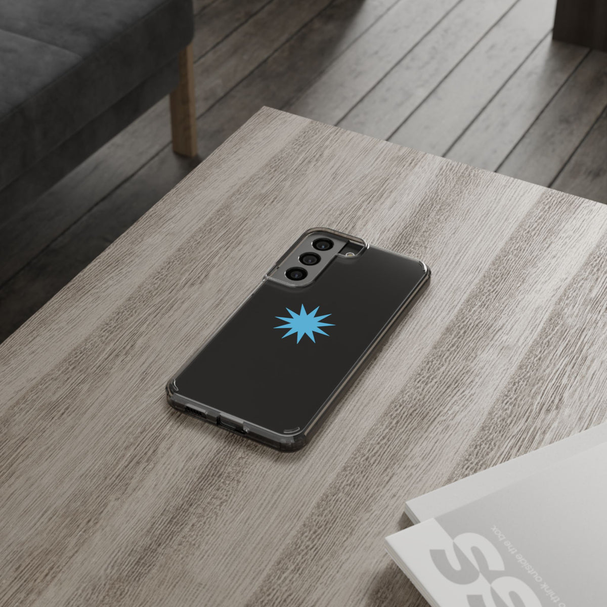 Clear Impact-Resistant Phone Case — Blue Starburst Design