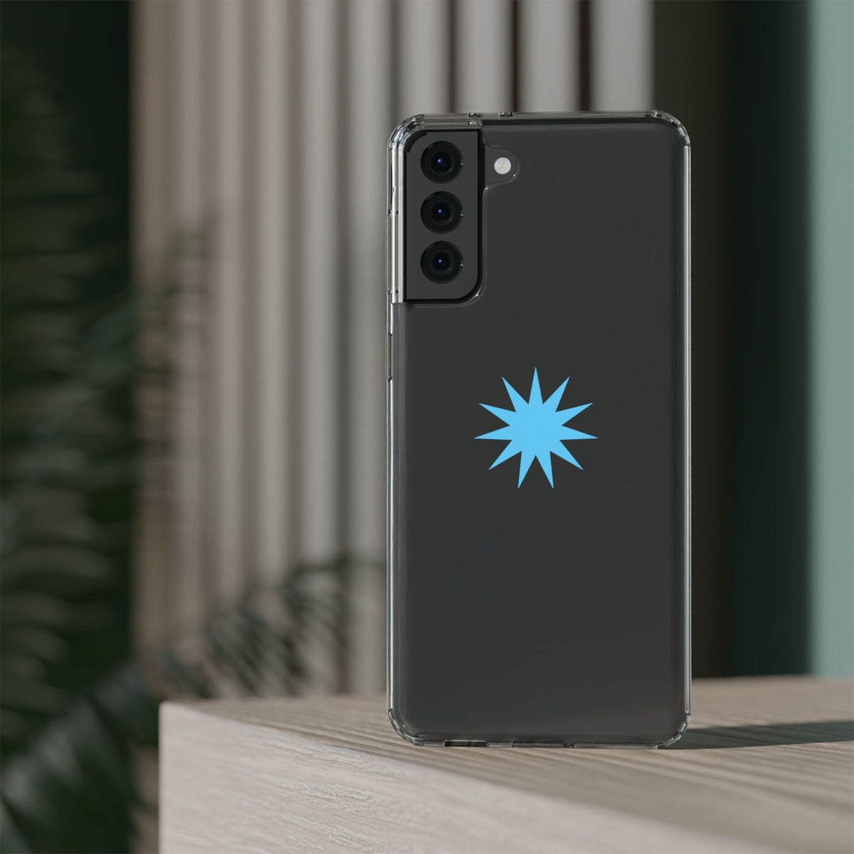 Clear Impact-Resistant Phone Case — Blue Starburst Design