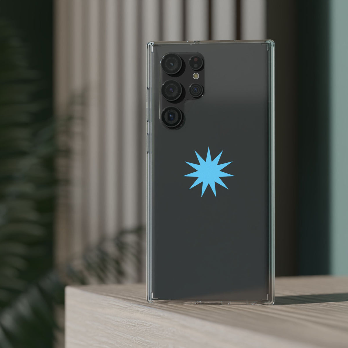 Clear Impact-Resistant Phone Case — Blue Starburst Design