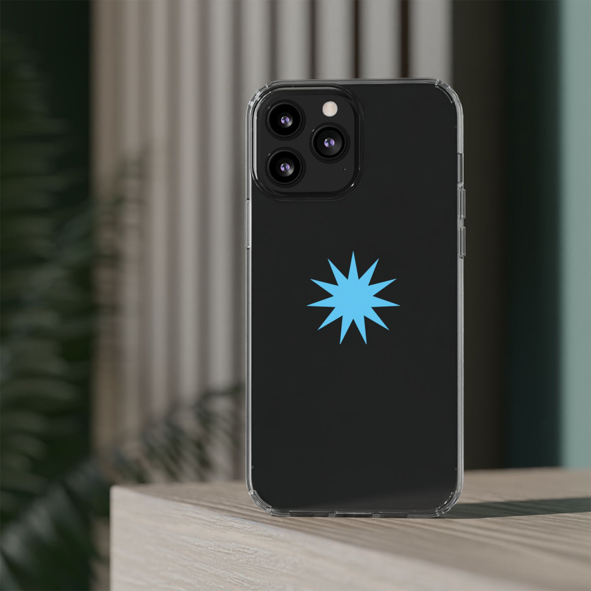 Clear Impact-Resistant Phone Case — Blue Starburst Design