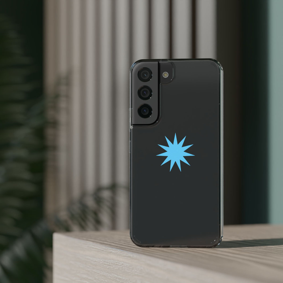 Clear Impact-Resistant Phone Case — Blue Starburst Design